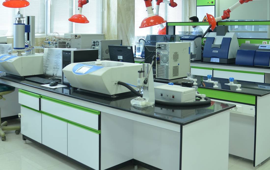 Instrument bench with GC and analytical instruments installed on epoxy worktops in a Scientora-built laboratory