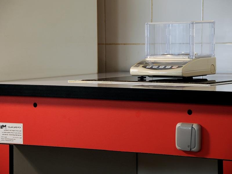 Analytical balance on an isolated Scientora balance table